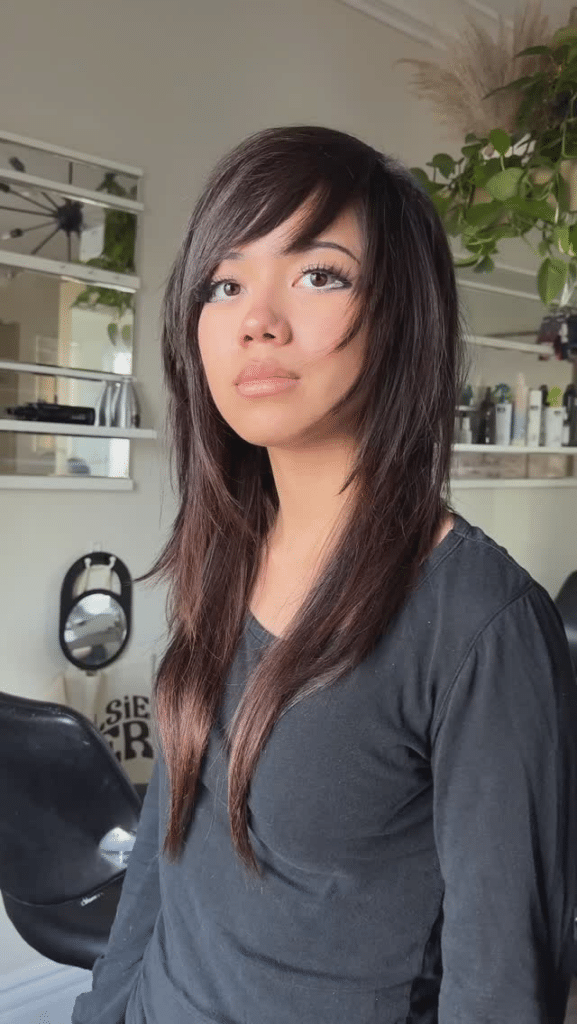 Shaggy wolf cut with wispy bangs and long layers