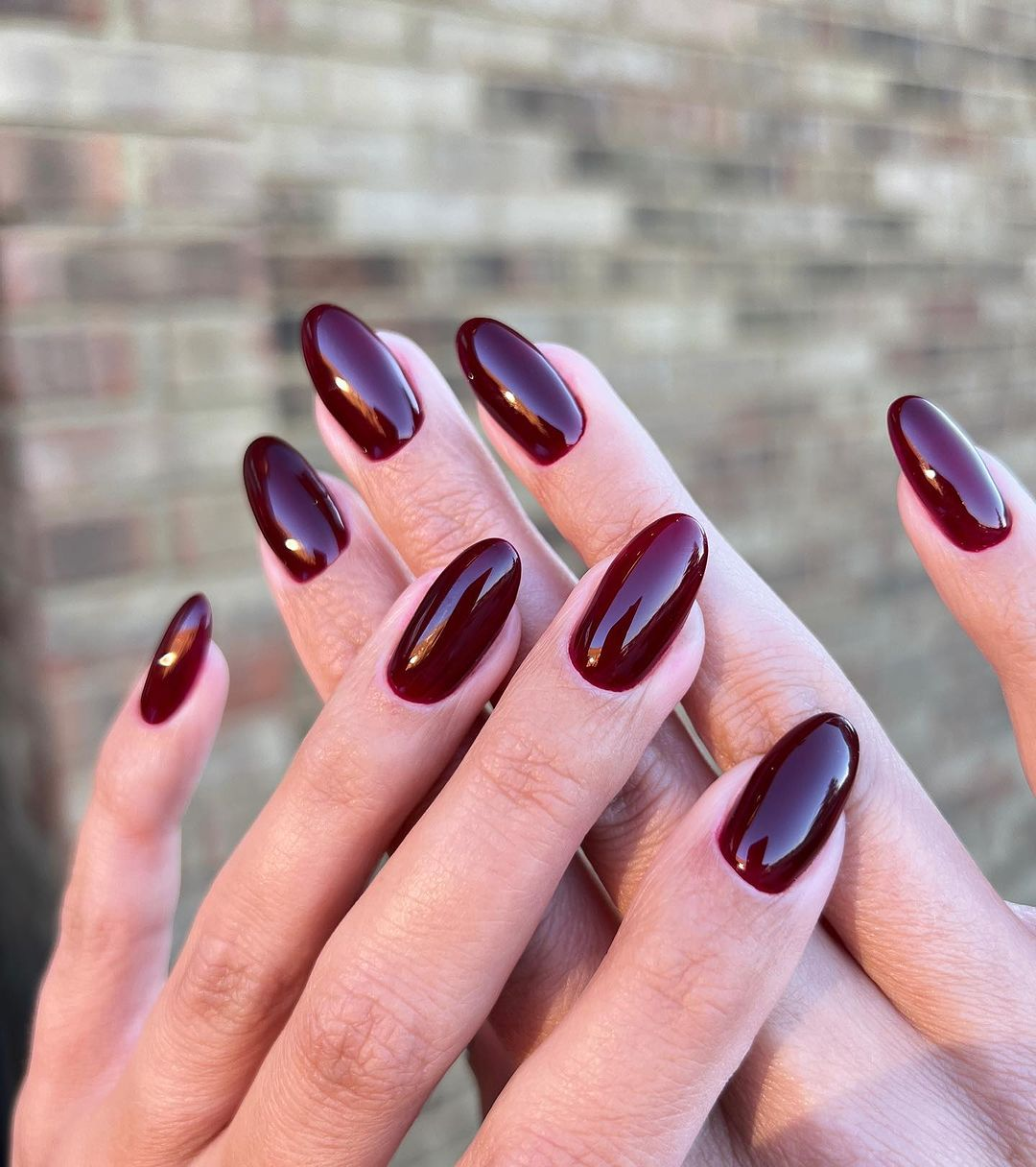 Deep red glossy almond nails
