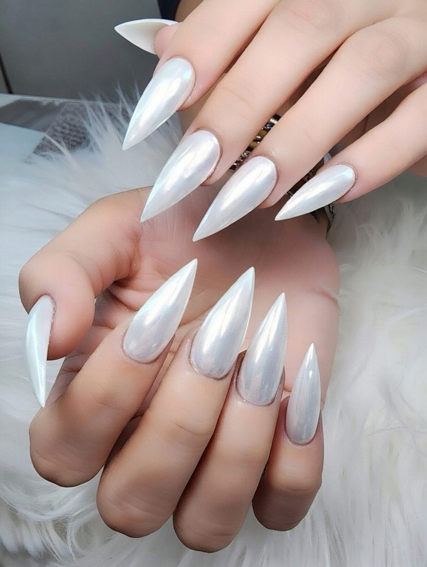 Milky white pearl chrome finish on very long stiletto nails