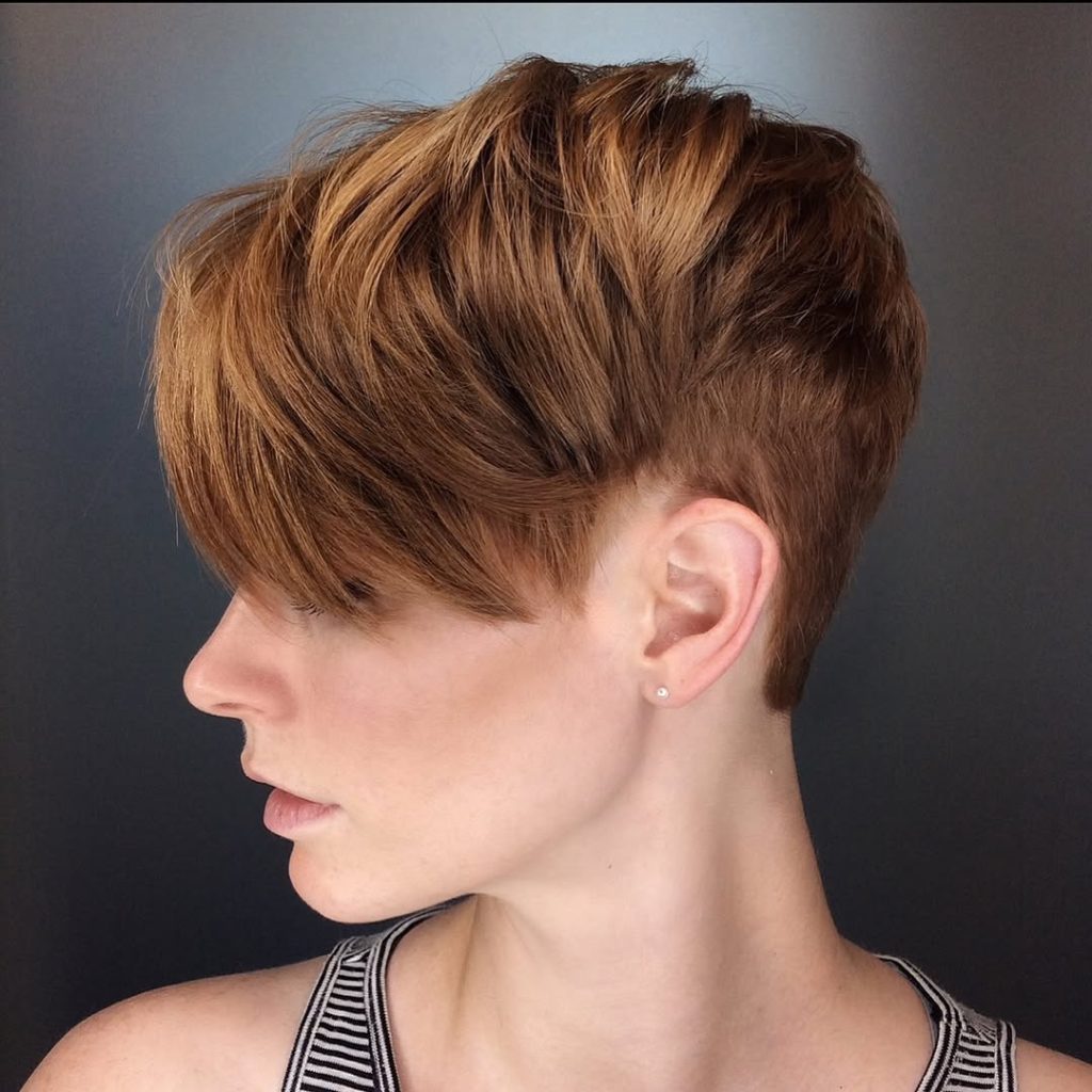 Copper pixie cut with long side-swept fringe, tapered sides