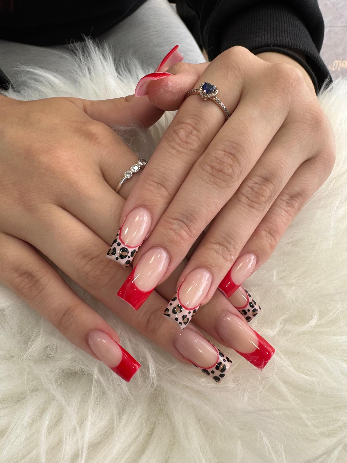Cherry red nails with a leopard print accent nail