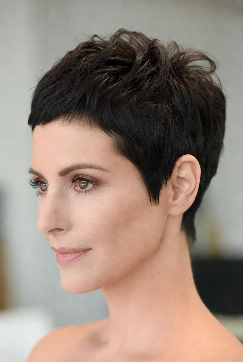 Short dark pixie crop with a side-swept fringe