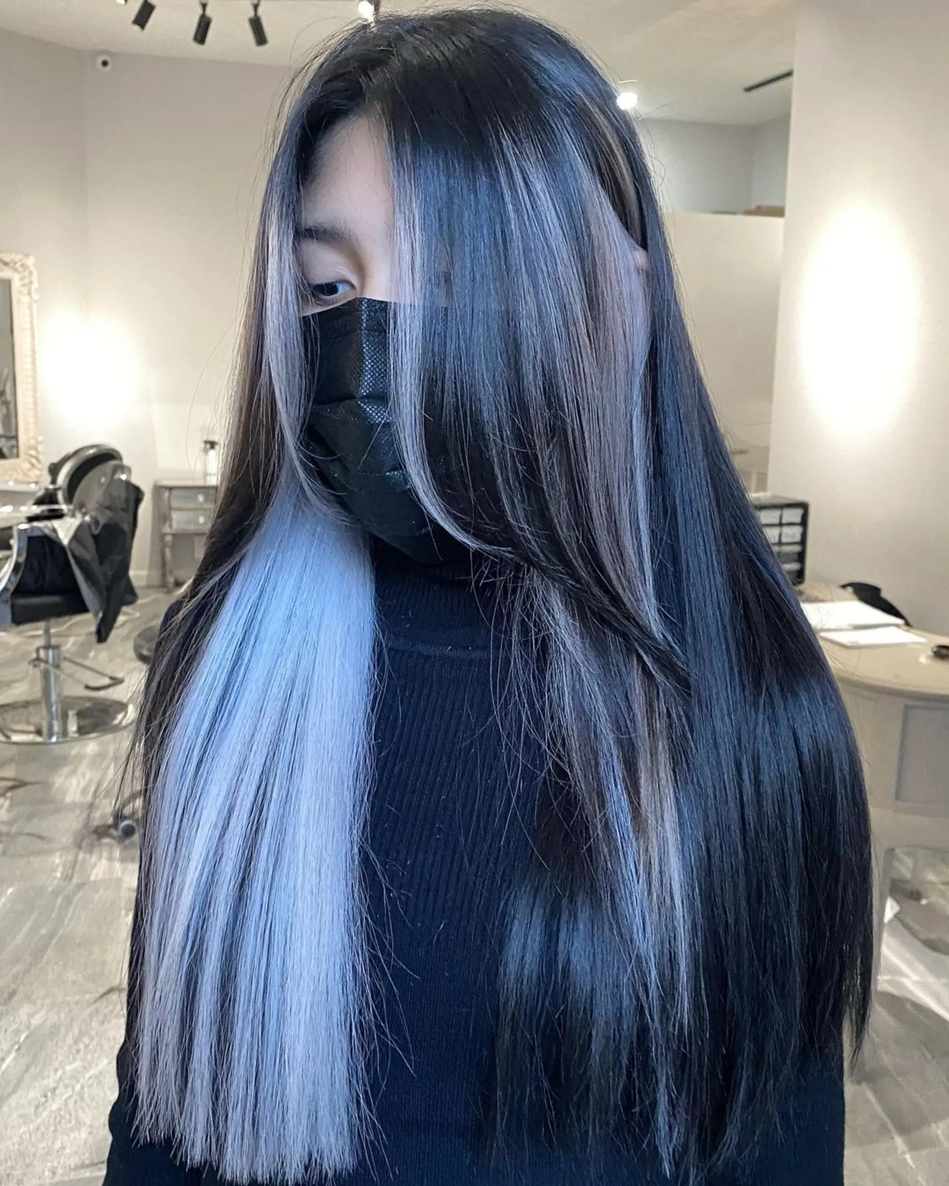 Jet black hair with icy platinum blonde money piece highlights