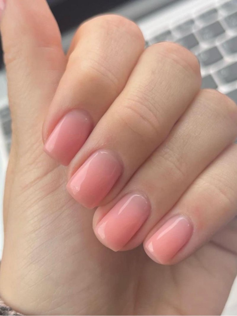 Very short square nails with a natural rosy builder gel finish