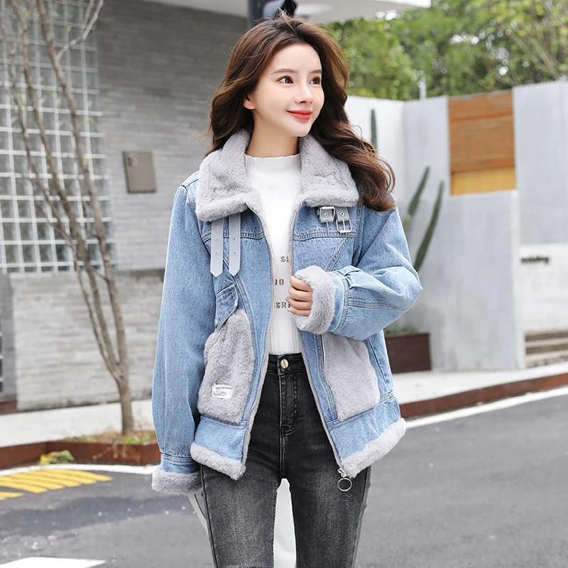 Woman in a sherpa-lined denim jacket over a white top with black jeans