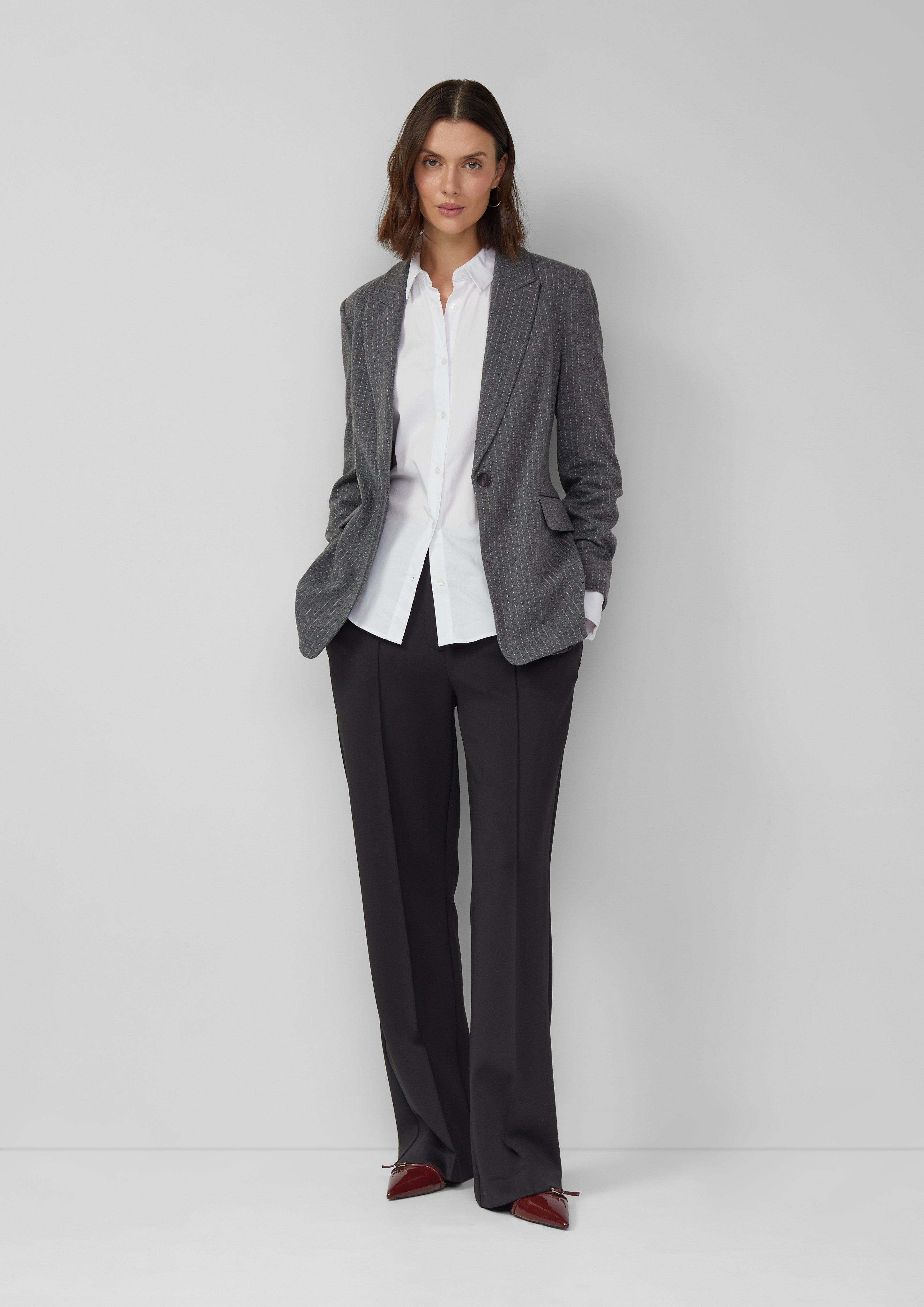 Classic Checks: A Gray Herringbone Blazer with a White Shirt and Black Trousers