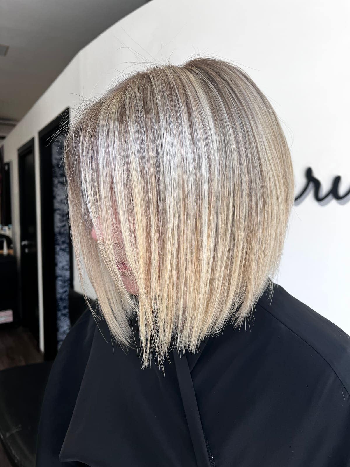 Blunt bob with shadow root in dark blonde