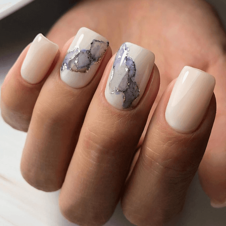 Short square nails in milky white with soft grey marble veining