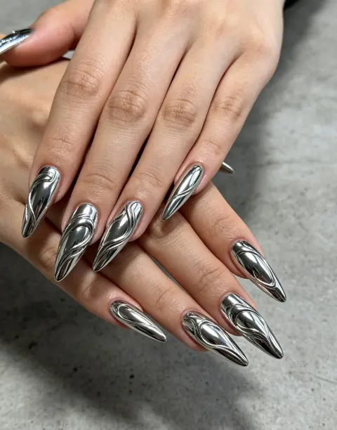 Long stiletto nails in mirror silver chrome
