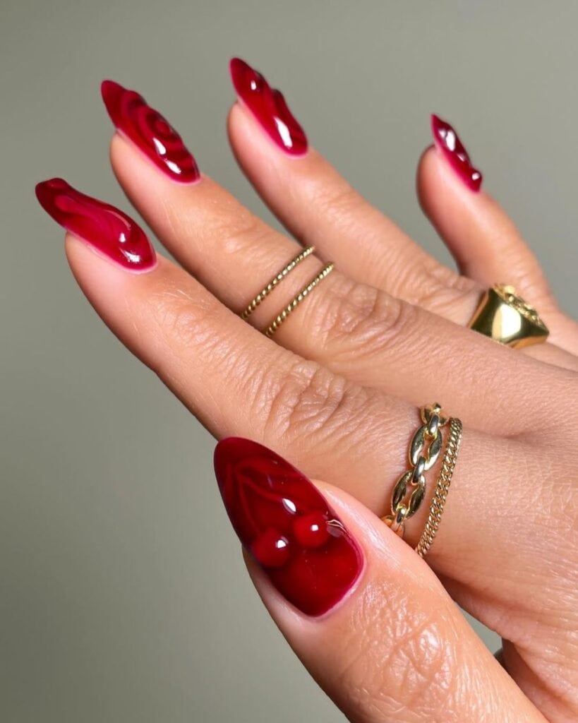 Translucent cranberry jelly gel nails in almond shape