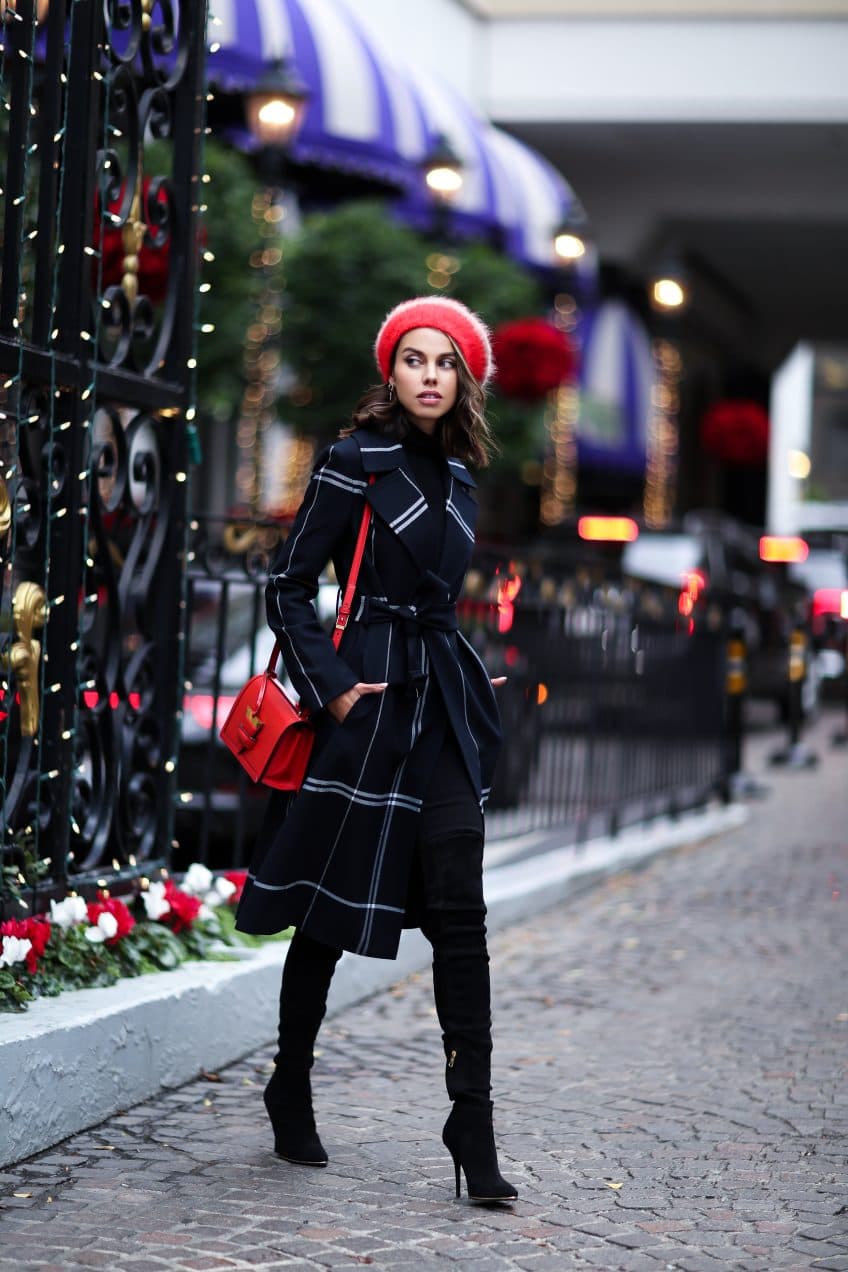 Woman in a plaid winter coat with a beret