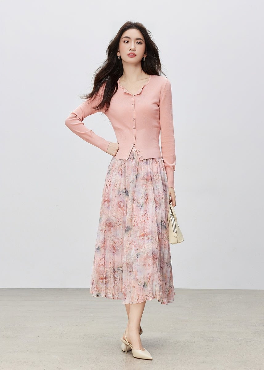 Pink buttoned cardigan with pink floral pleated midi skirt and cream heels