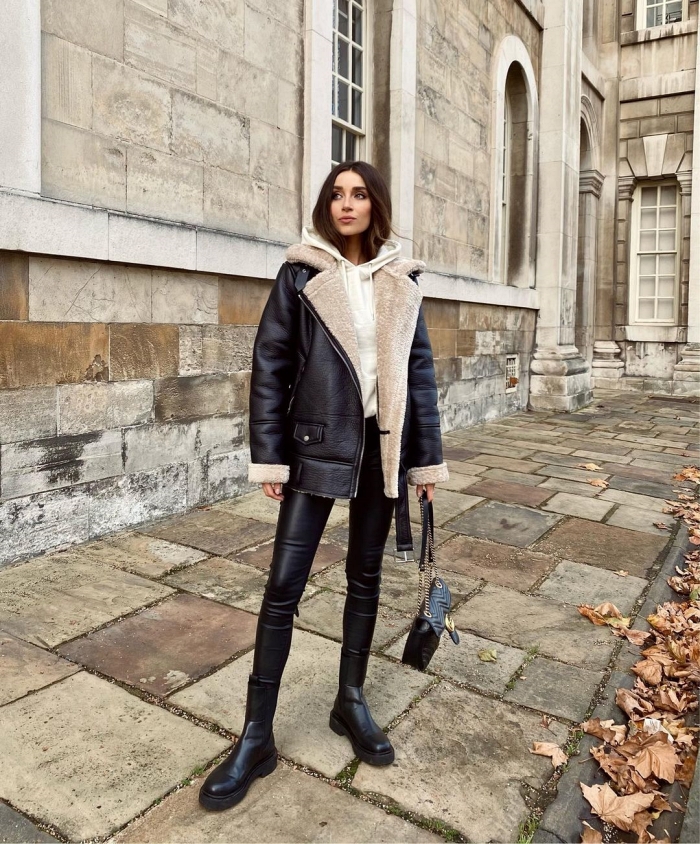 Woman wearing denim with a statement shearling jacket