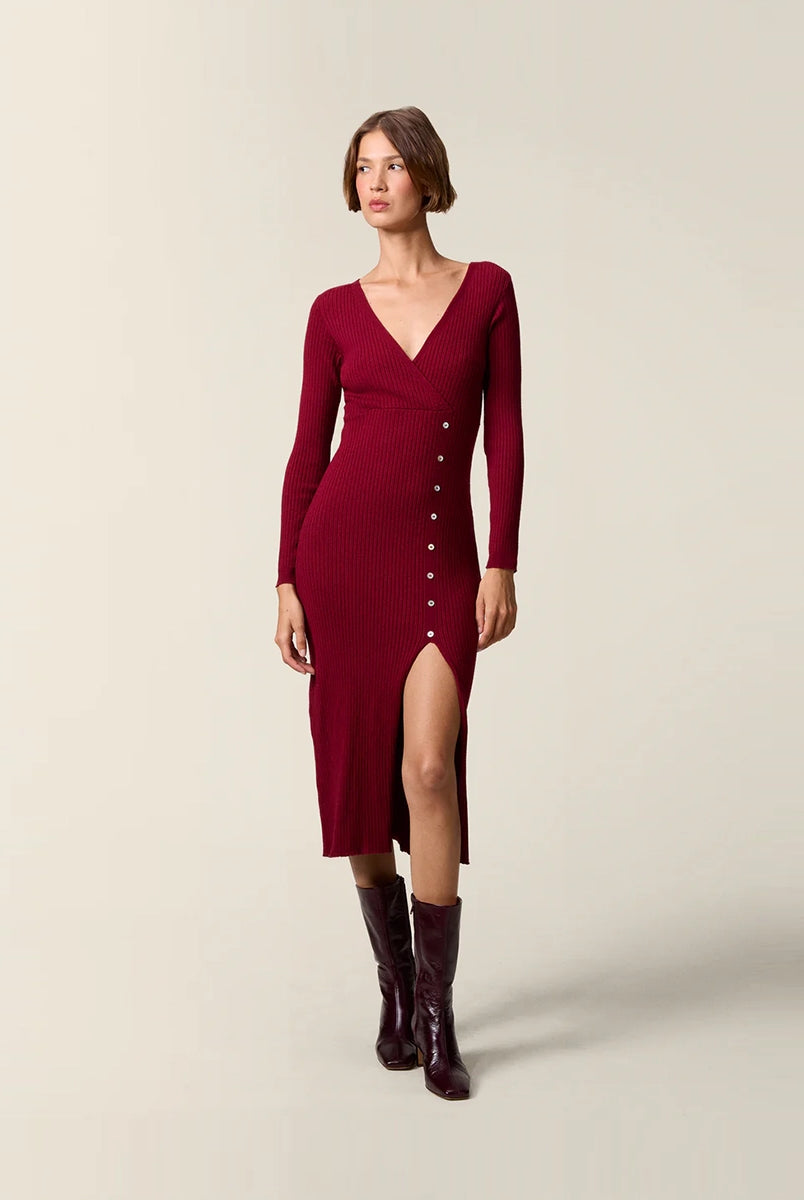 Burgundy knit dress on a model
