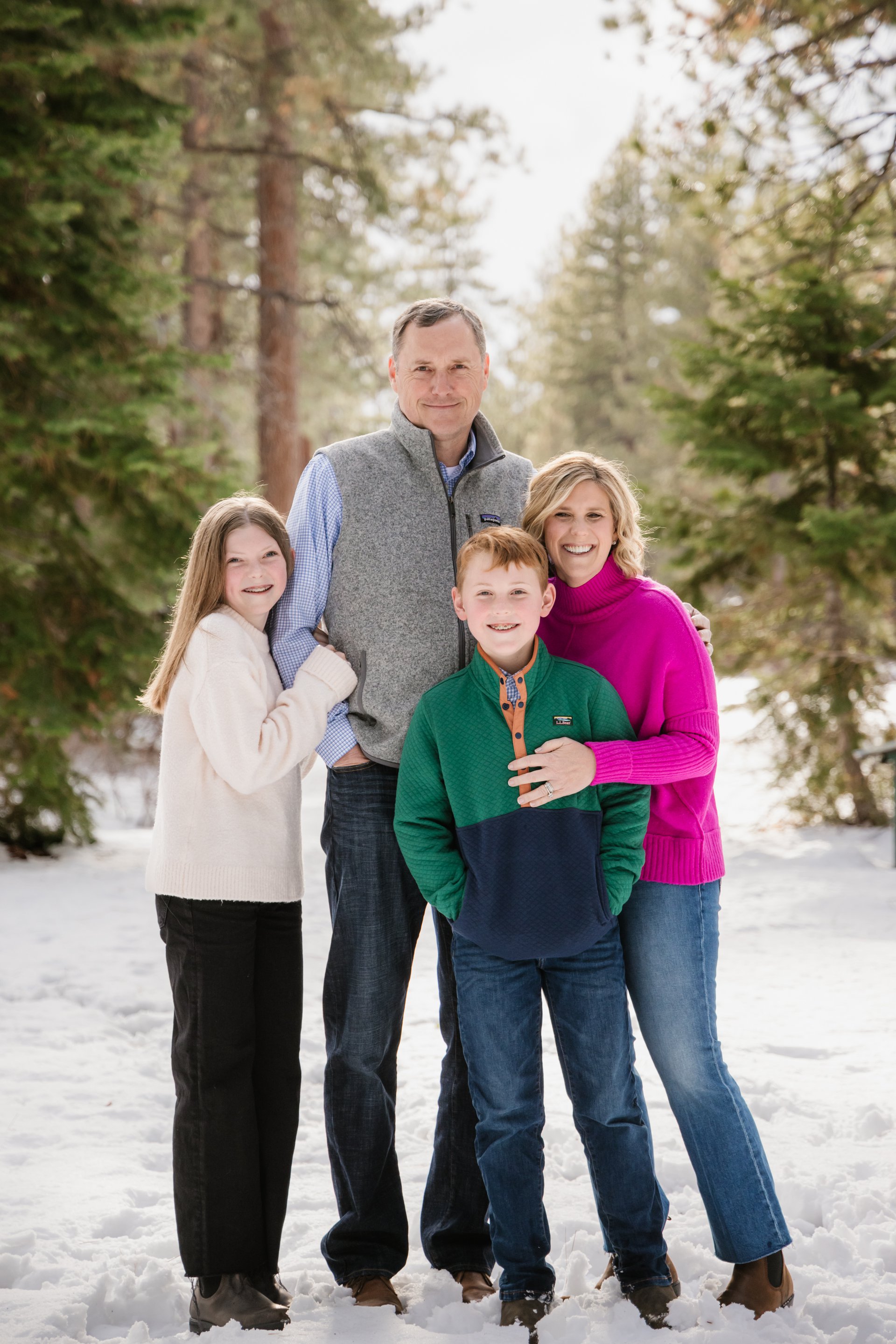 Family in turtleneck sweaters during a winter trip photoshoot