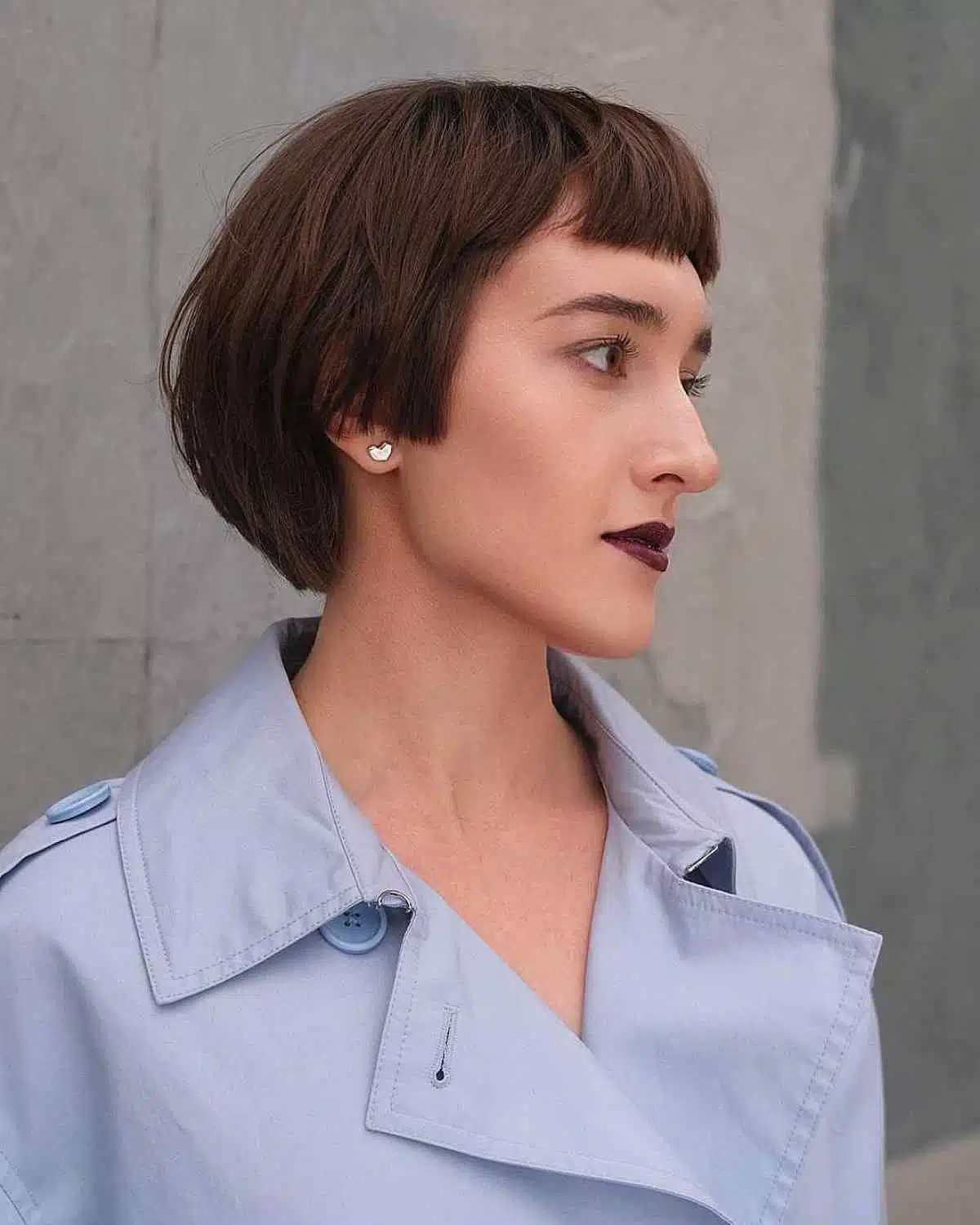 Dark brown short layered bob with straight micro bangs