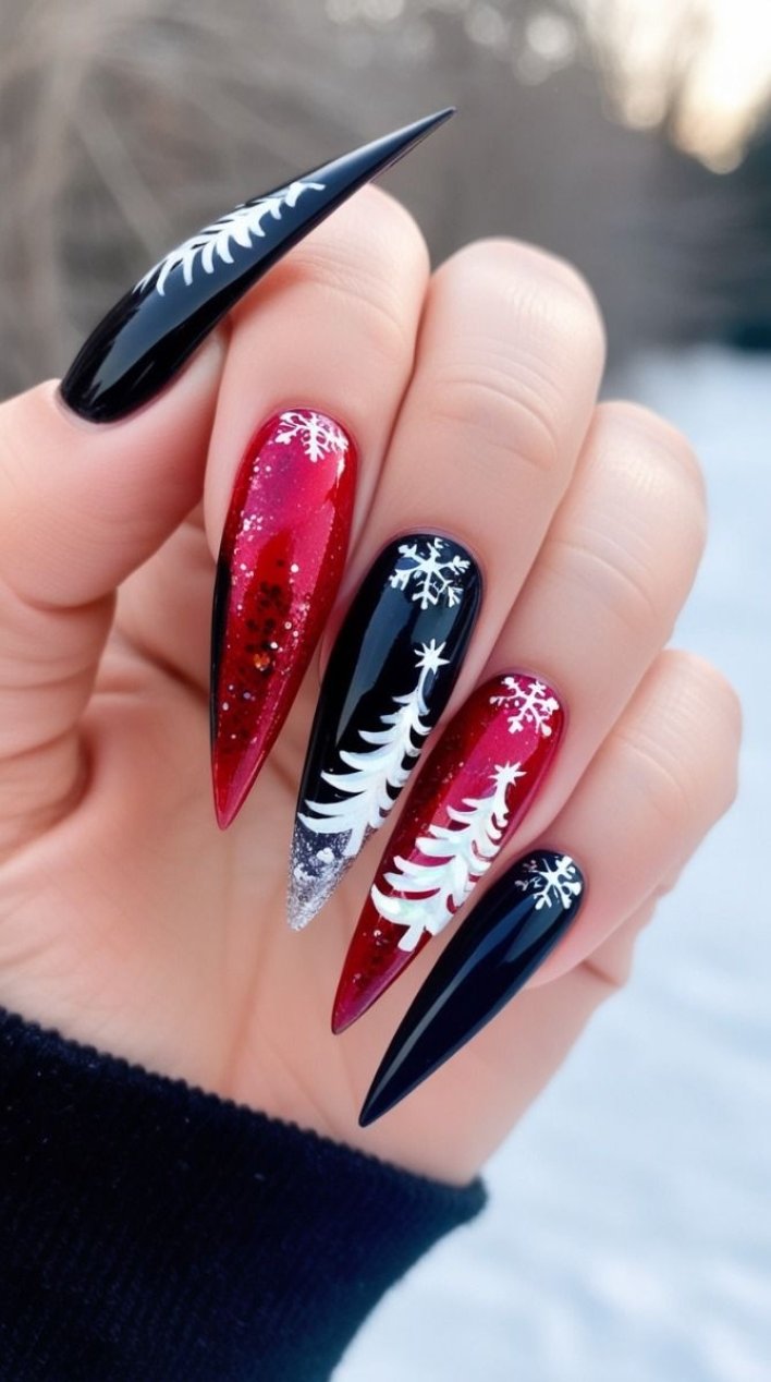 Alternating black and red stiletto nails with white tree and snowflake art