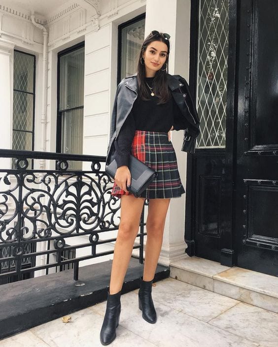 Leather jacket over a plaid mini skirt with ankle boots