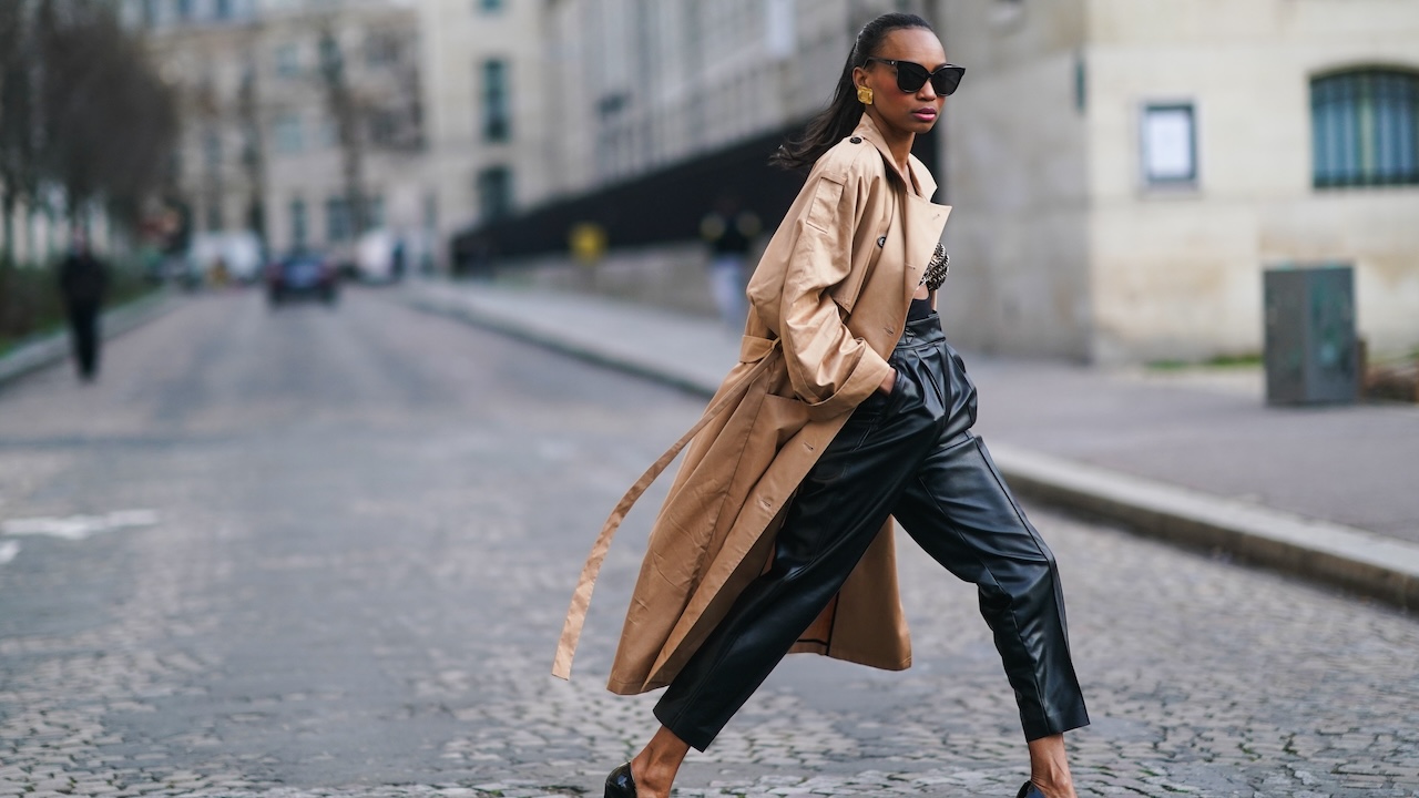 Woman styling leather trousers with a fitted winter top