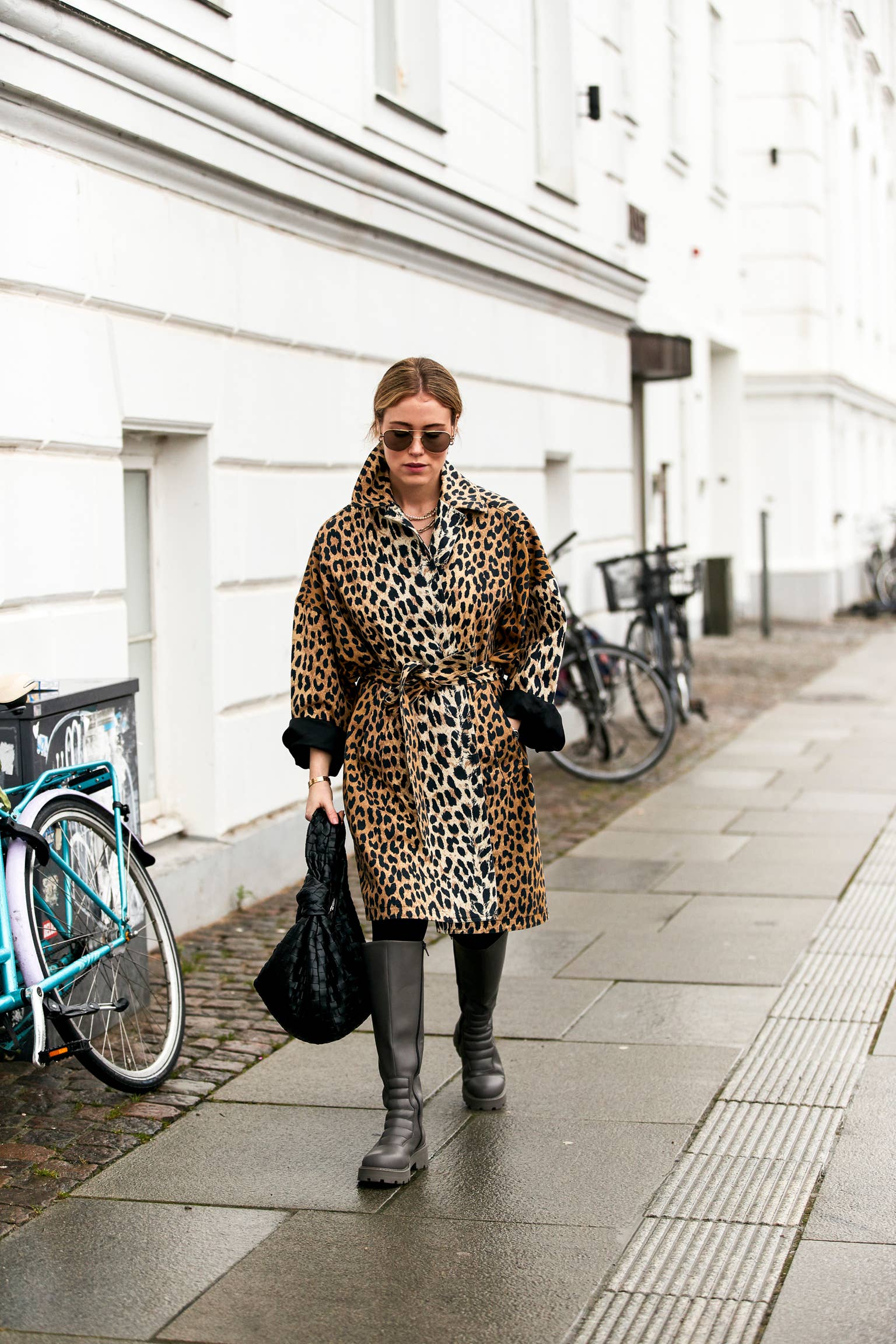 Street style leopard print coat outfit with knee-high boots