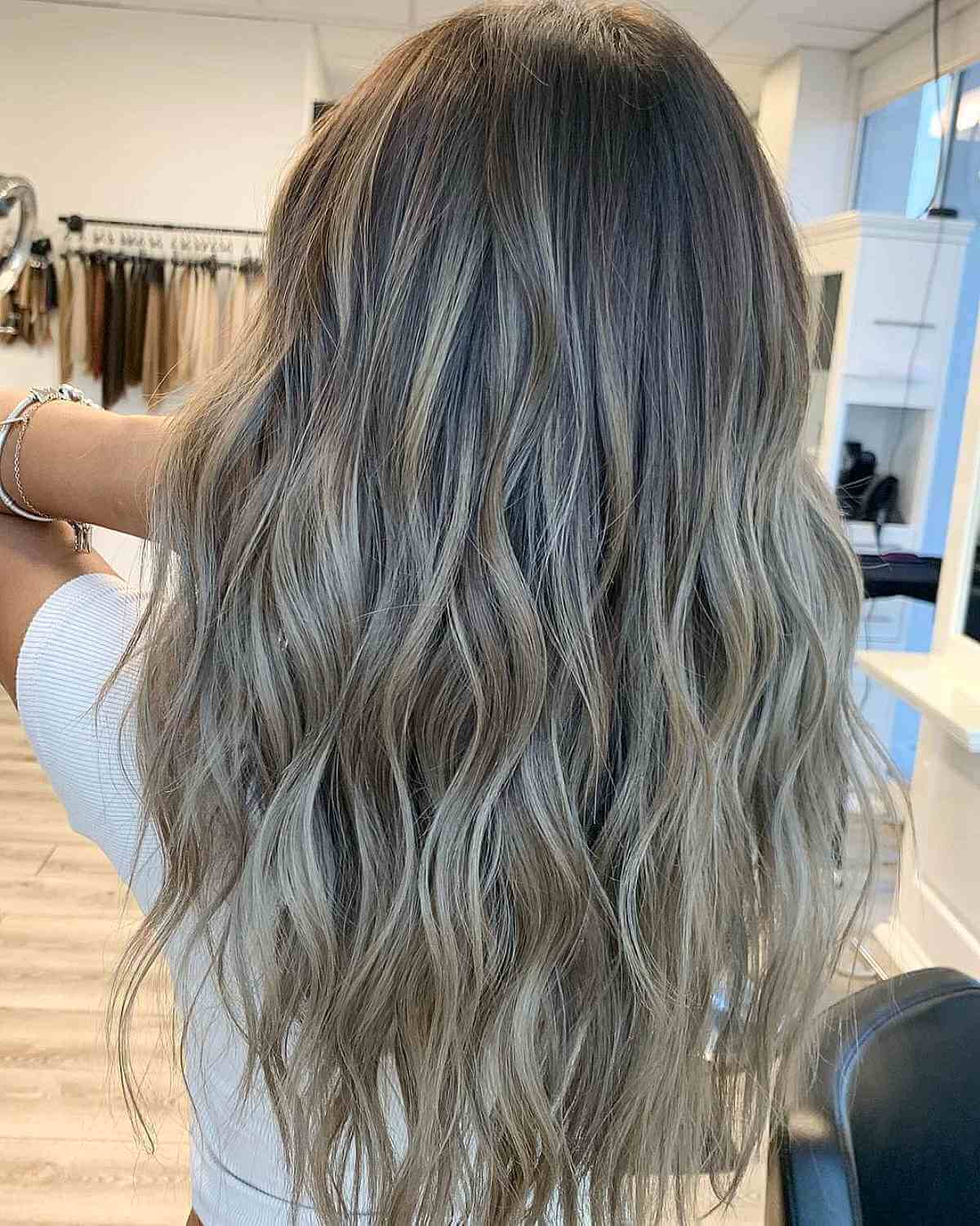 Long wavy mushroom ash blonde hair with taupe tones
