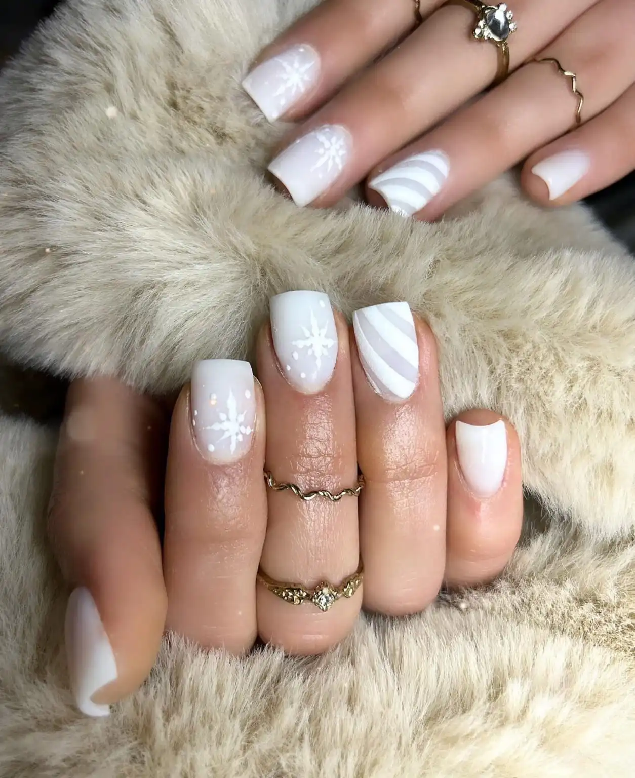 Short square nails with delicate white snowflake nail art