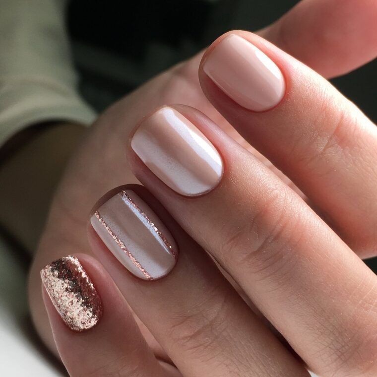 Nude nails with rose-gold glitter stripes and one full glitter accent nail