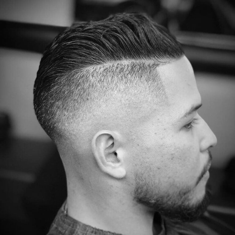 Man with a classic undercut and side-swept longer top