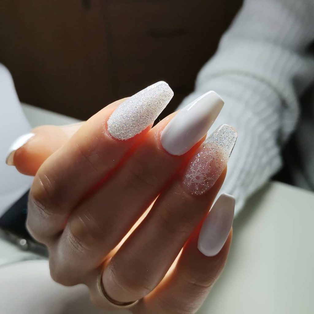 Full-coverage frosted white glitter nails with a sparkling icy finish