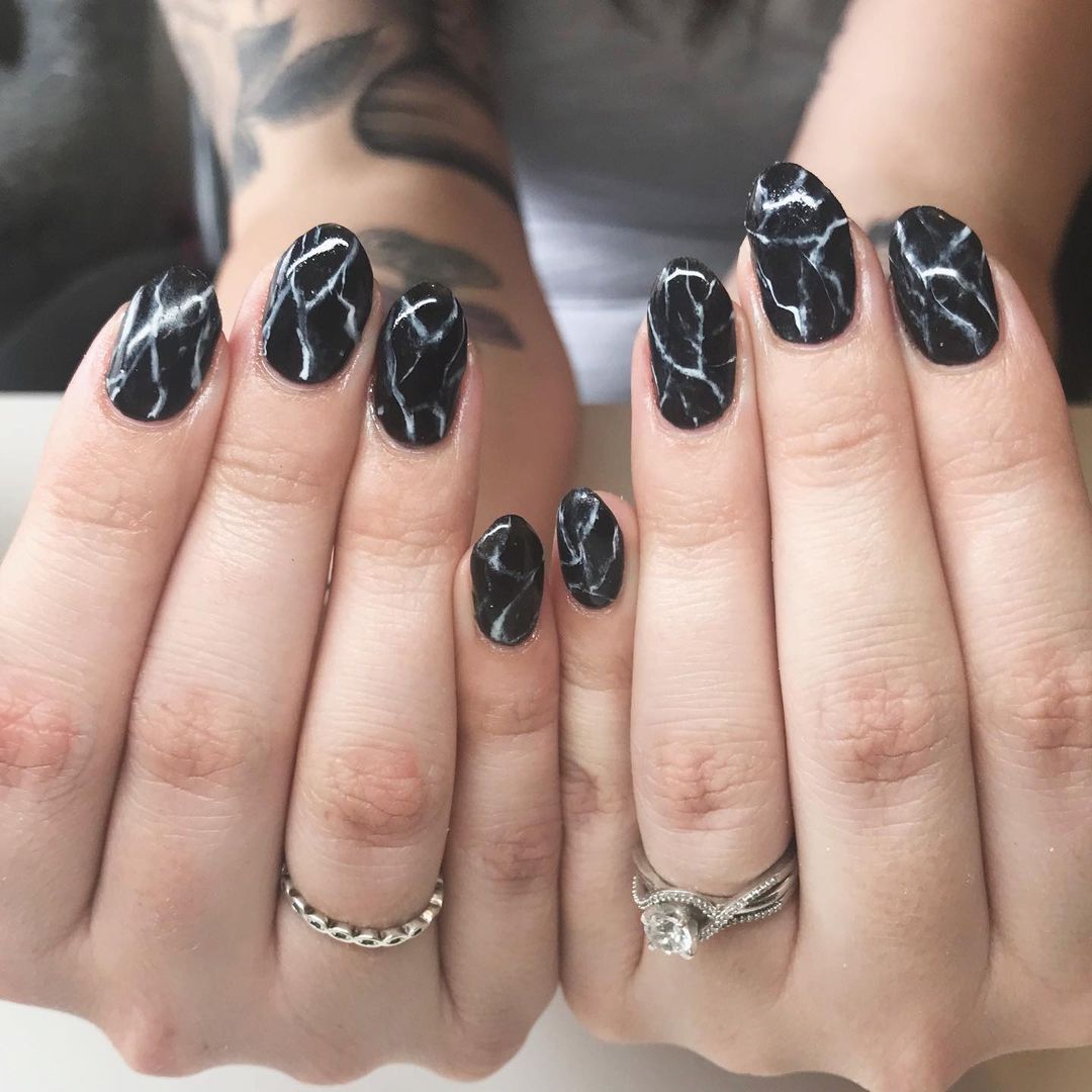 Black marble nails with striking white veins