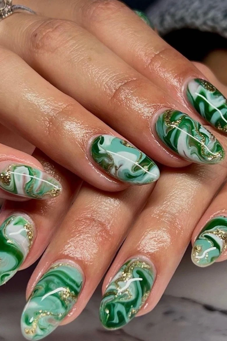 Emerald green and white marble swirl nail art