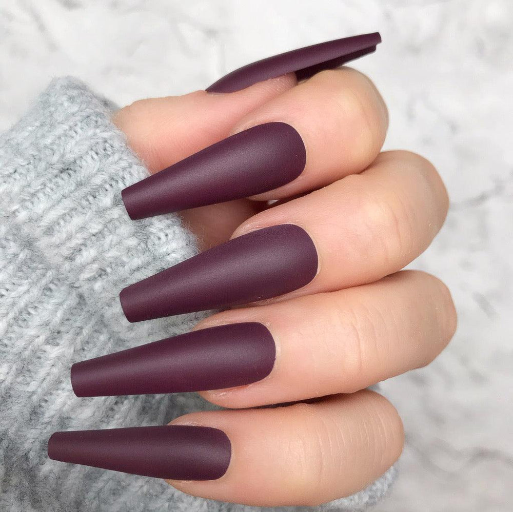 Matte maroon coffin nails in medium length