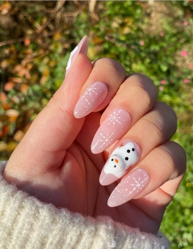 3D snowman nail art on sheer almond nails