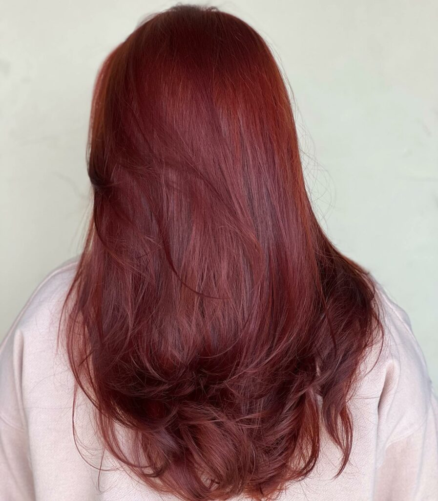 Merlot red-brown long layered wavy hair