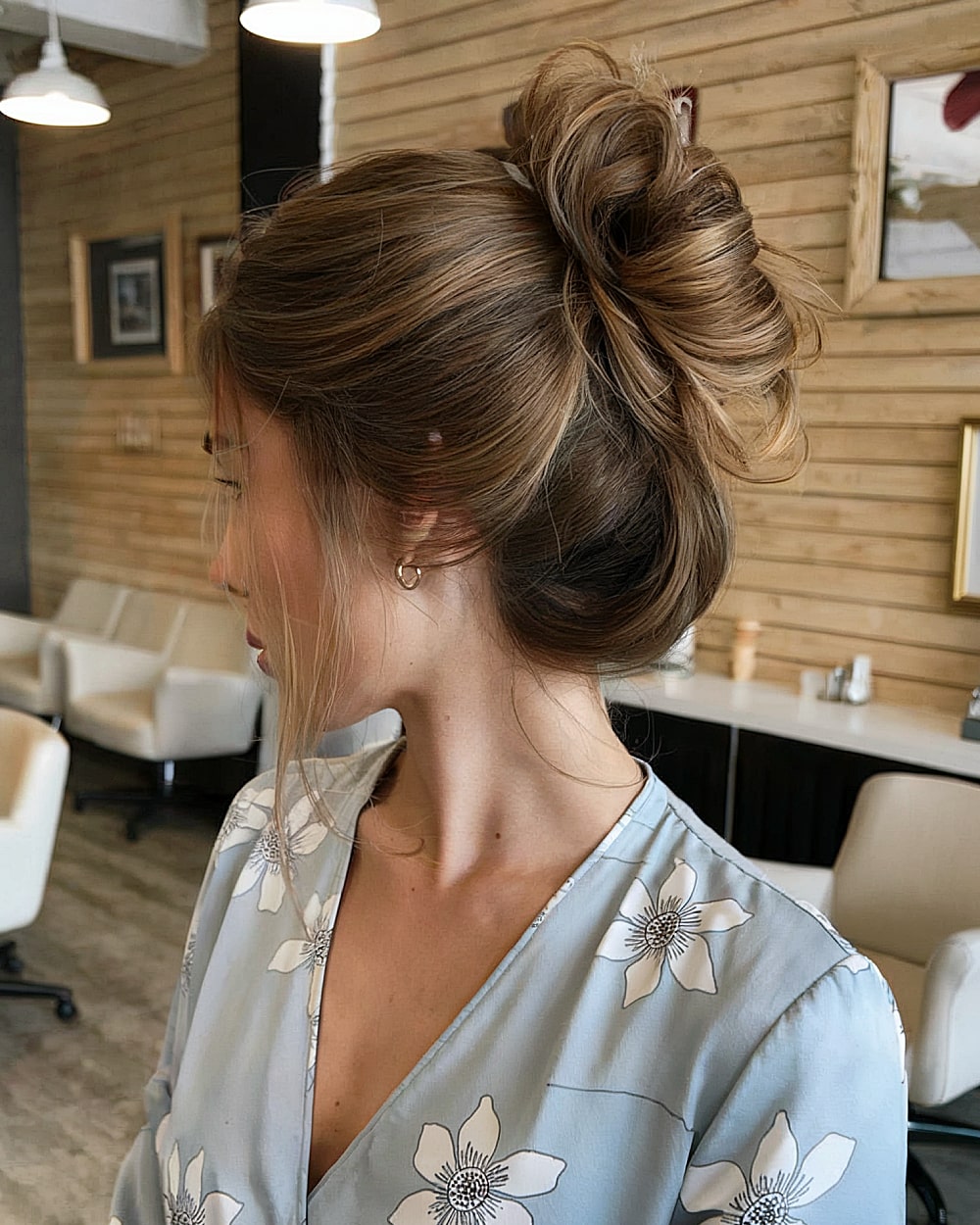 Messy textured French twist with lifted crown and soft tendrils