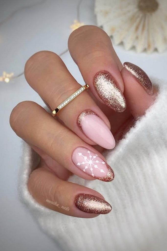 Rose gold glitter nails with snowflake accent
