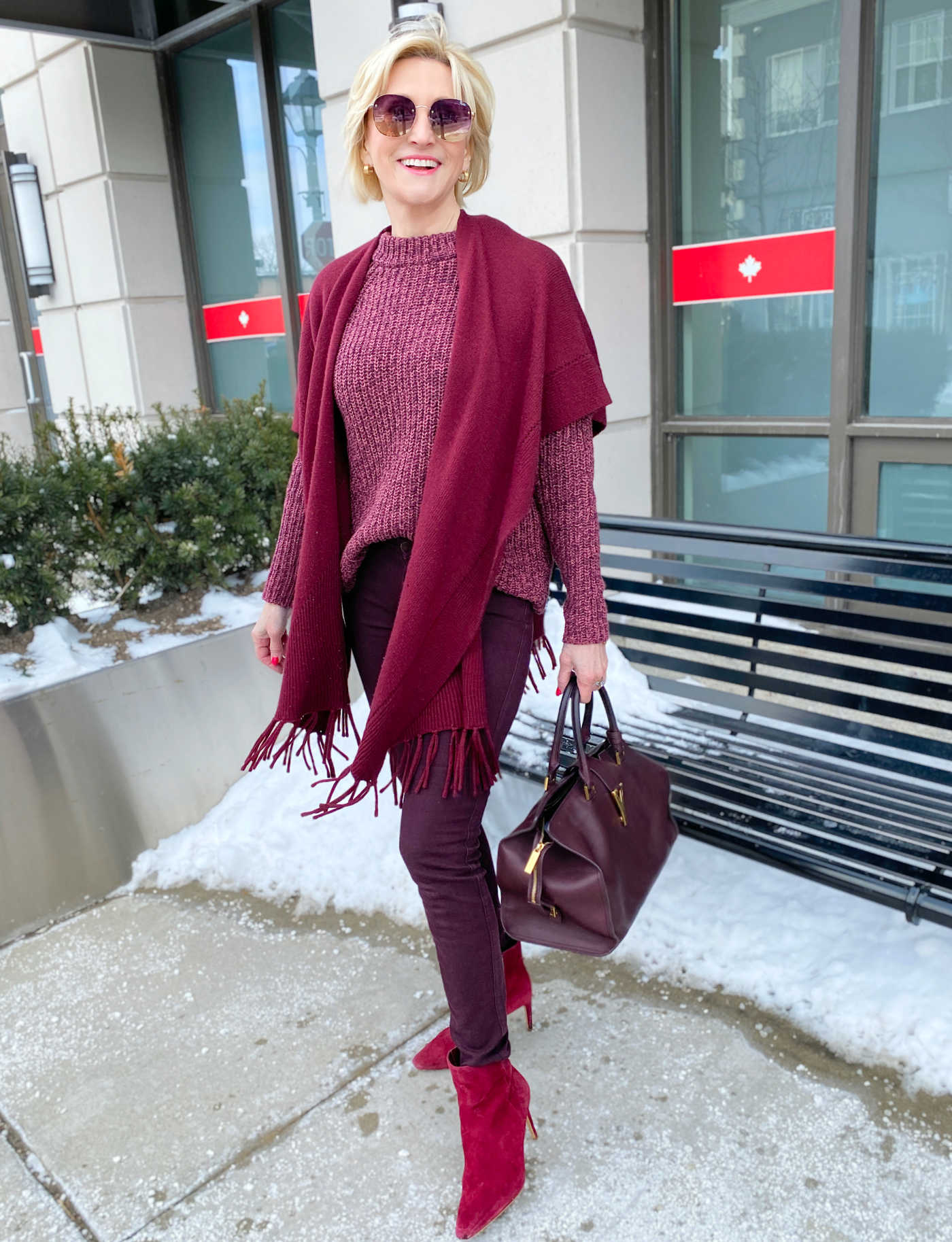 Woman in a head-to-toe monochromatic burgundy winter outfit