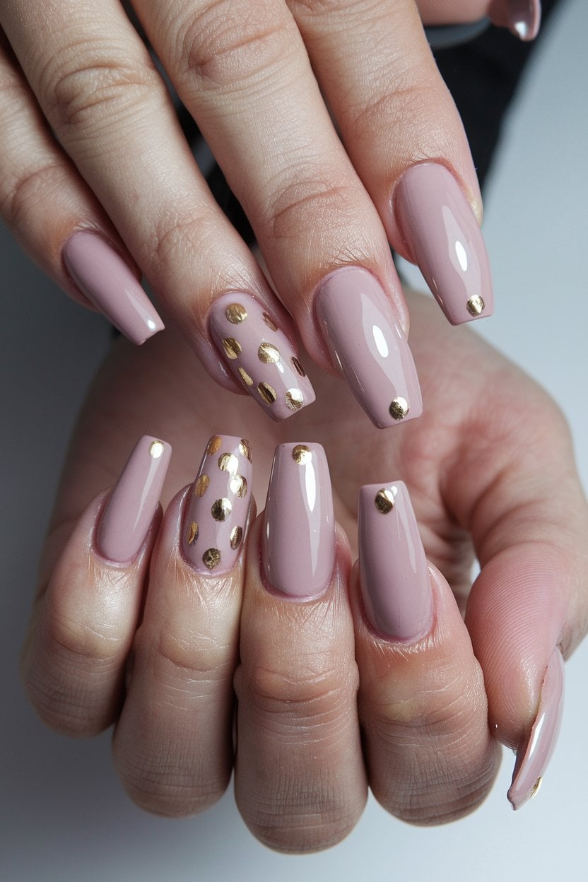 Nude nails with small minimalist gold dot accents