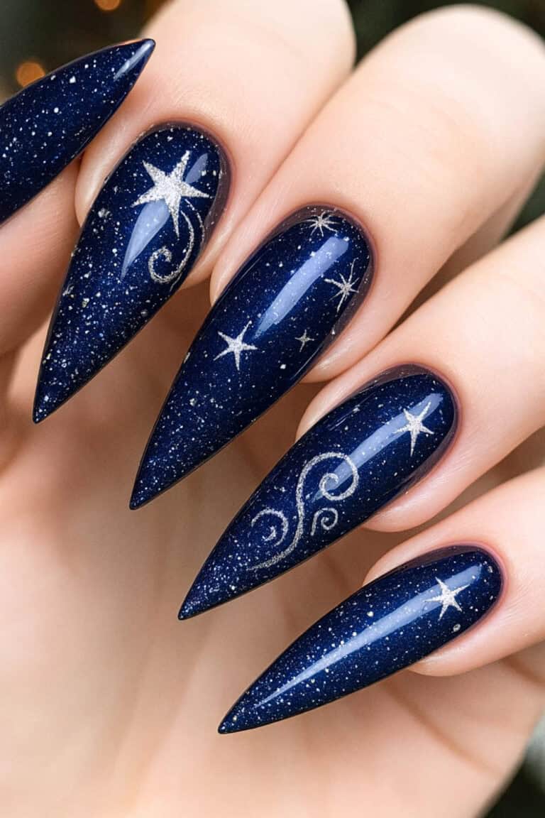 Long stiletto nails in midnight navy with silver glitter and silver star art