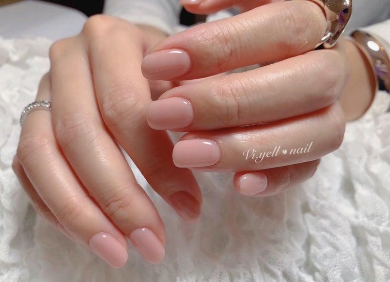 Short nails in sheer blush pink jelly polish with glossy finish