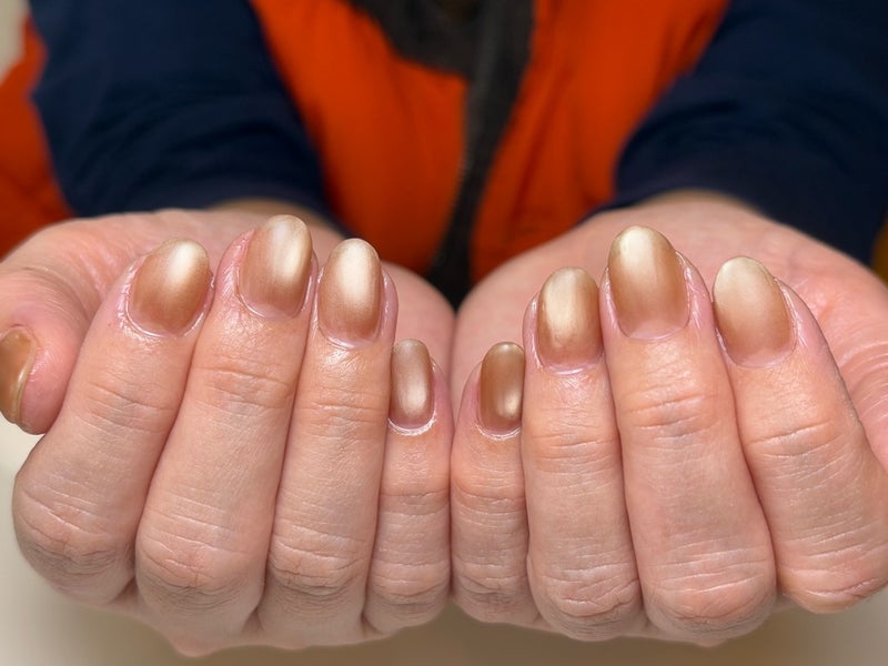 Deep Champagne Bronze: a rich bronze-champagne mirror on oval nails