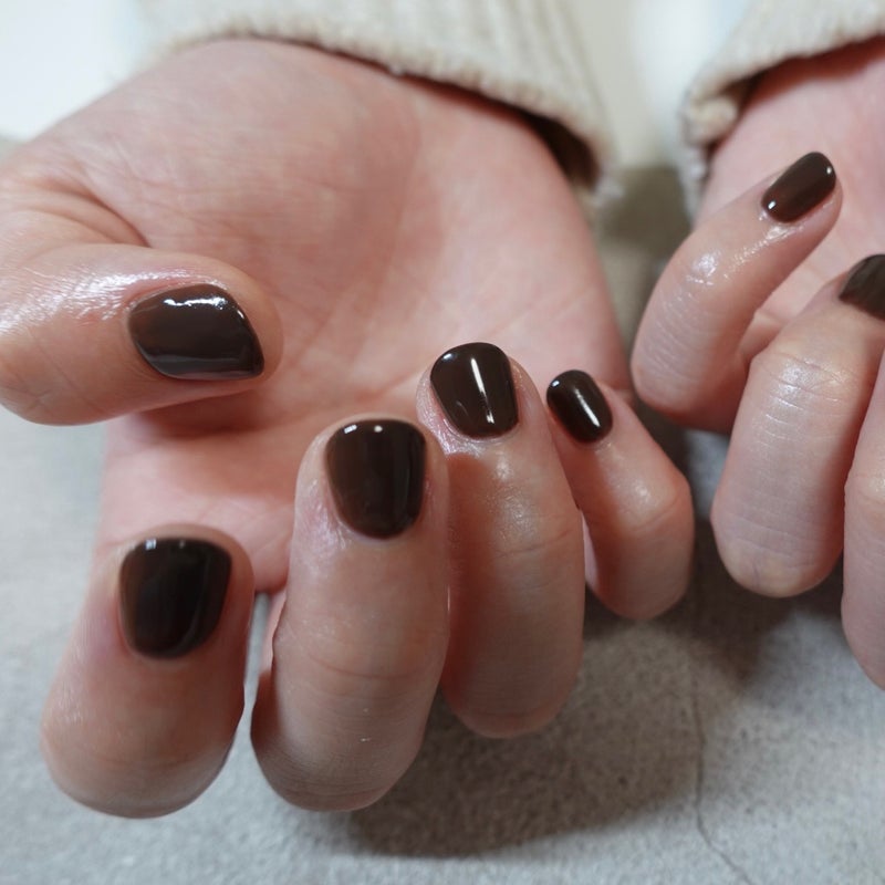 Short nails with warm chocolate brown creme polish
