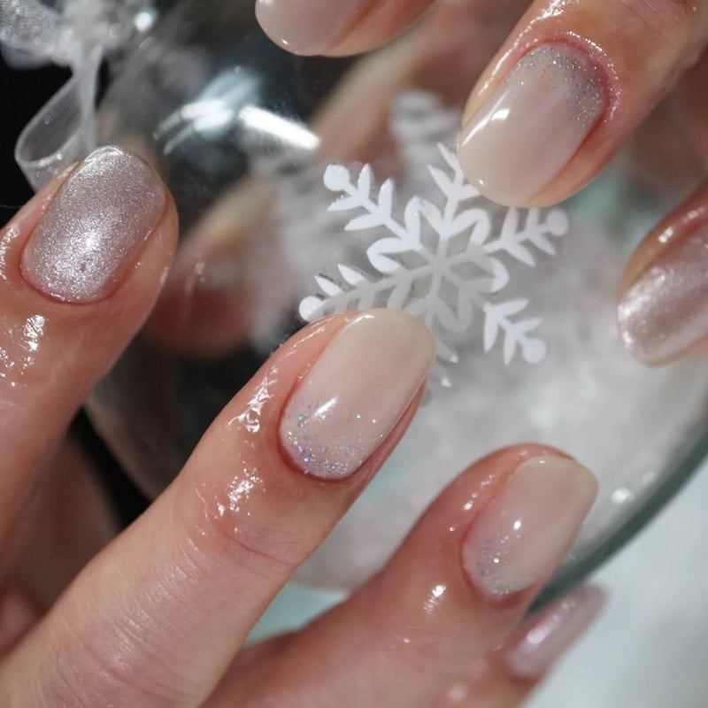 Short oval Christmas nails with champagne shimmer polish