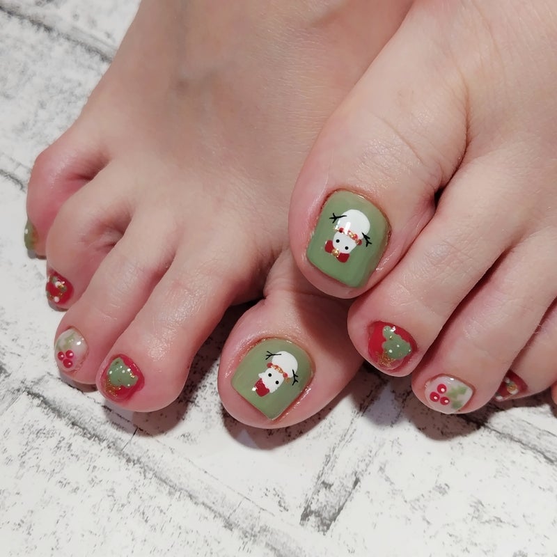 Sage green pedicure with snowman faces, reindeer and holly berry art