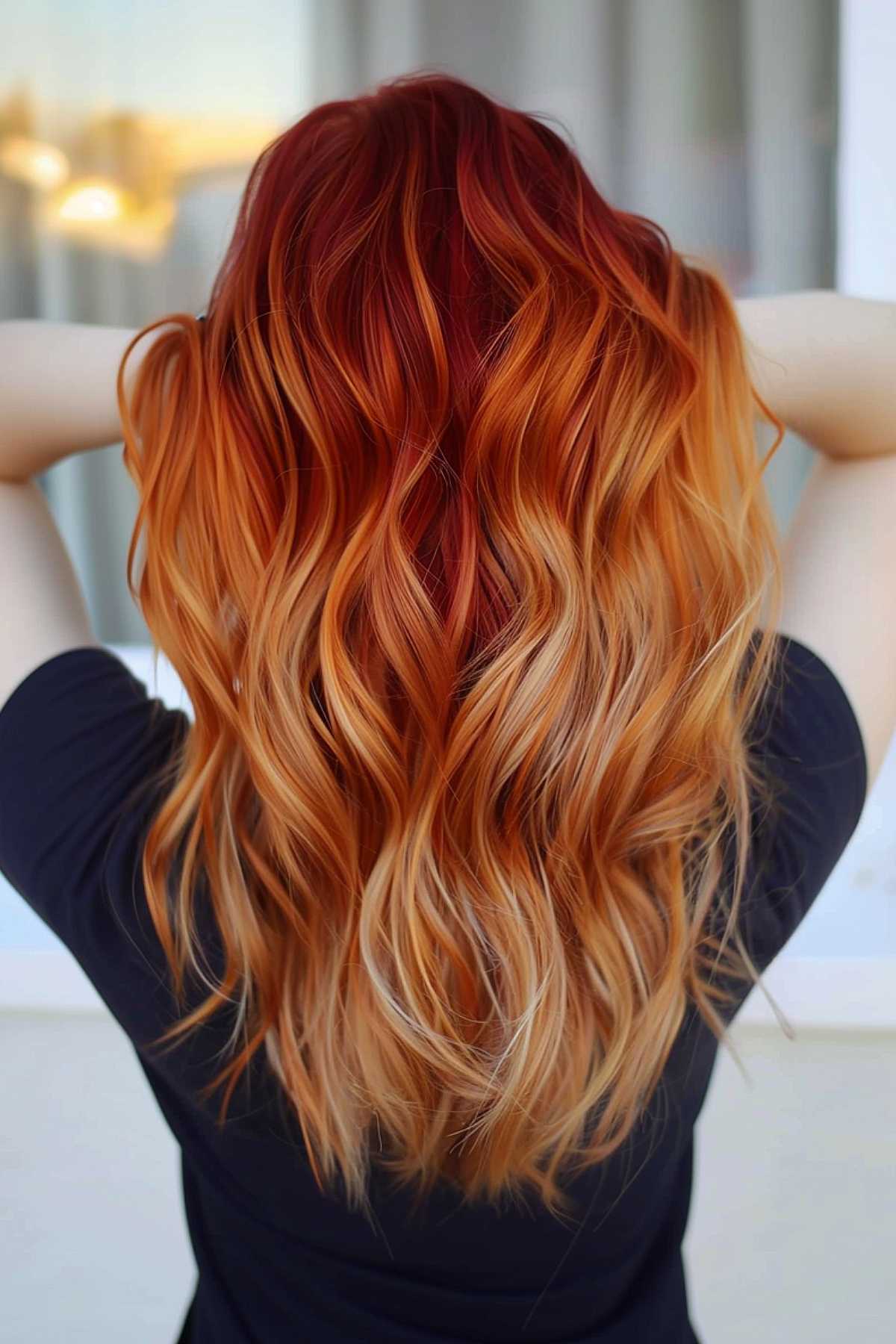 Long wavy hair with caramel-copper ombre from dark auburn roots