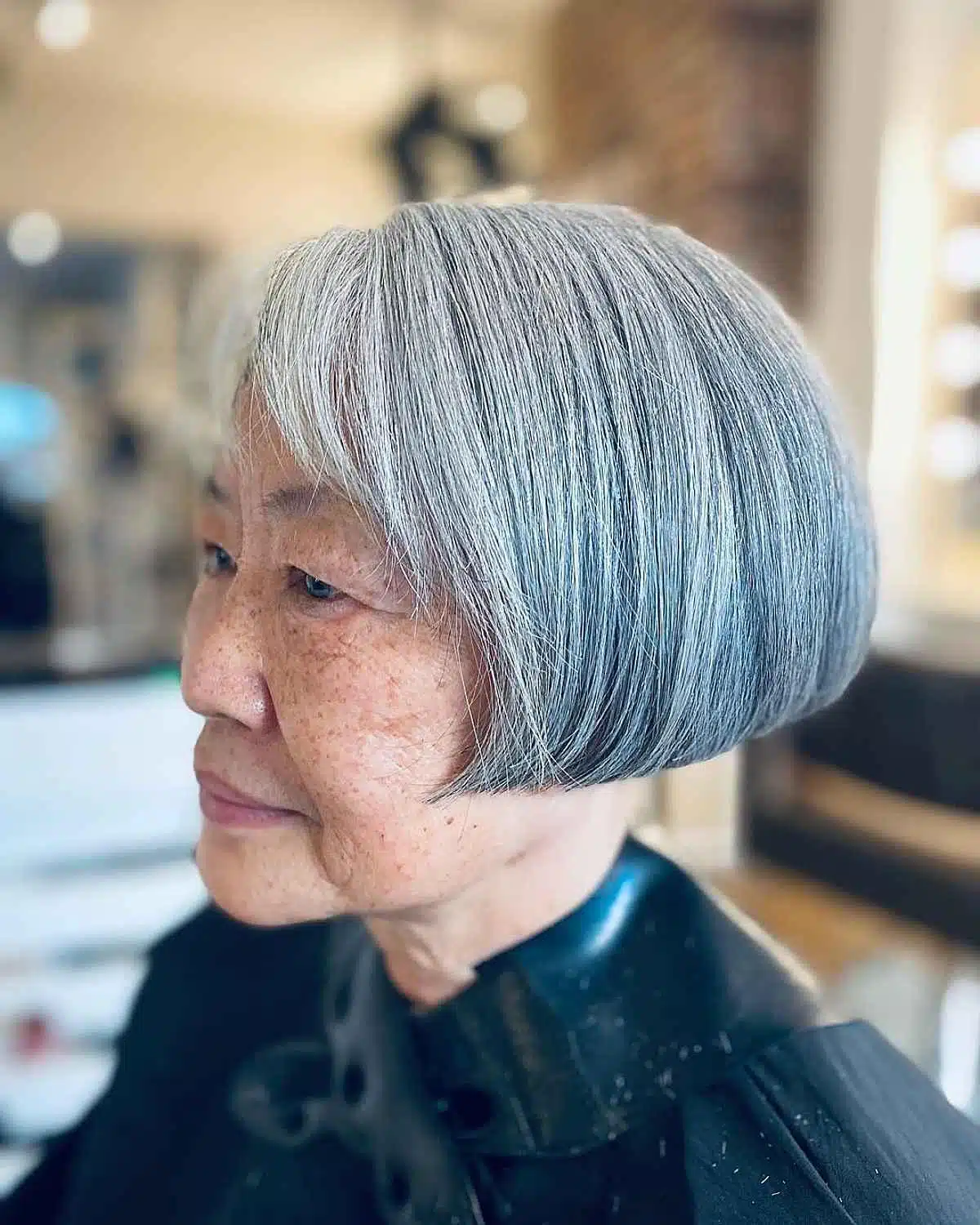 Silver one-length bob with ash tones