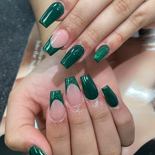 Medium square nails in emerald green with glitter French tips