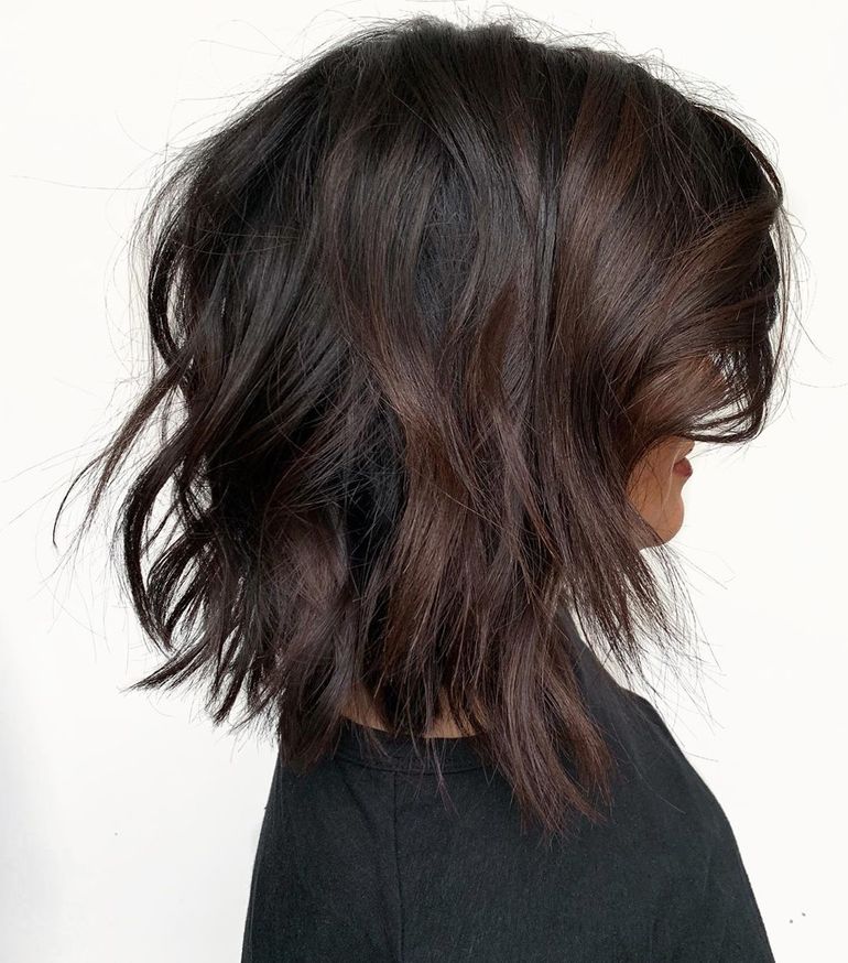 Wavy chocolate brown collarbone bob with fringe