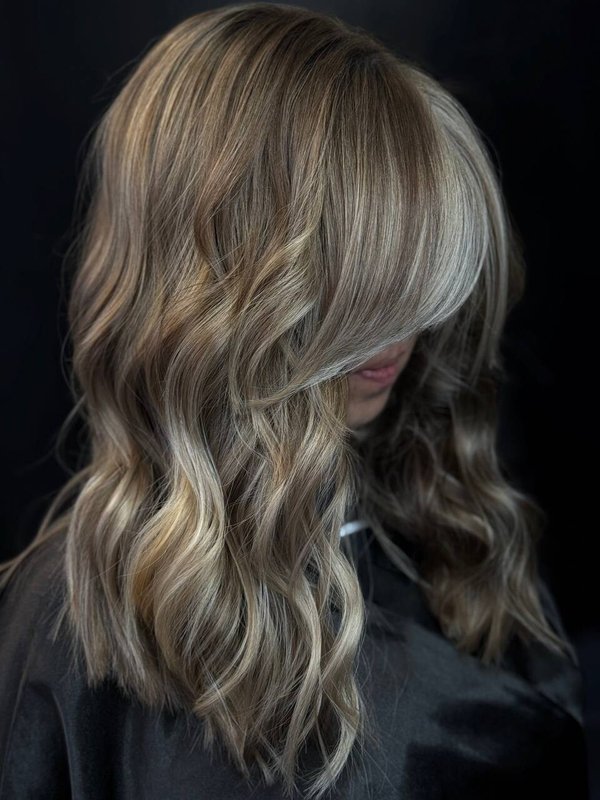 Medium-long beachy waves with ash-blonde balayage