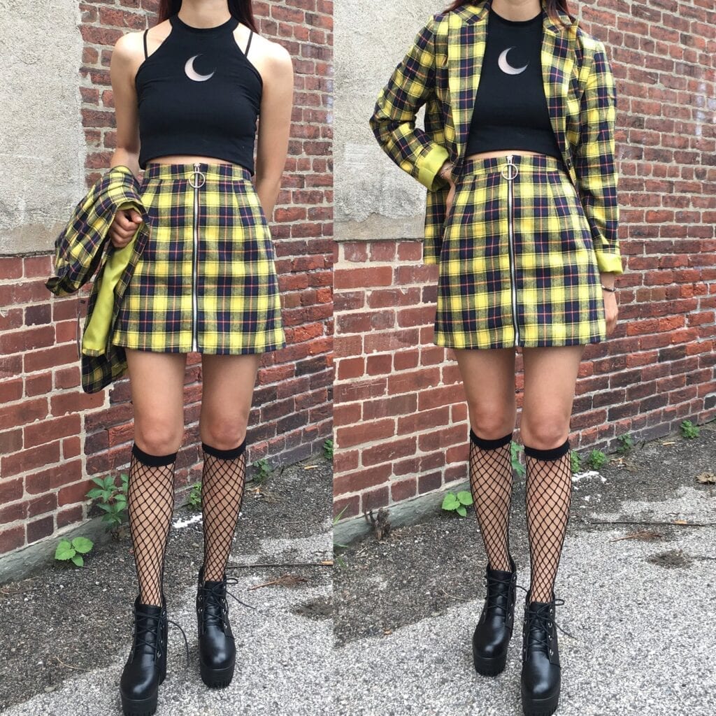 Black crop top with a yellow plaid skirt and fishnet socks